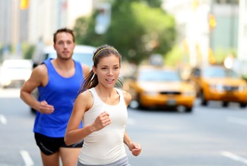 man and lady running in street